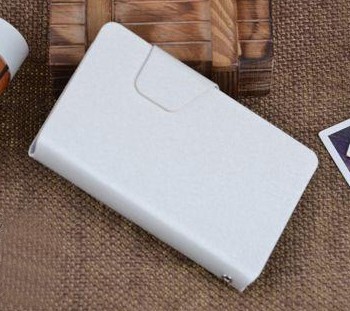 Текстурный чехол флип подставка с застежкой и внутренними карманами для Sony Xperia E dual Белый